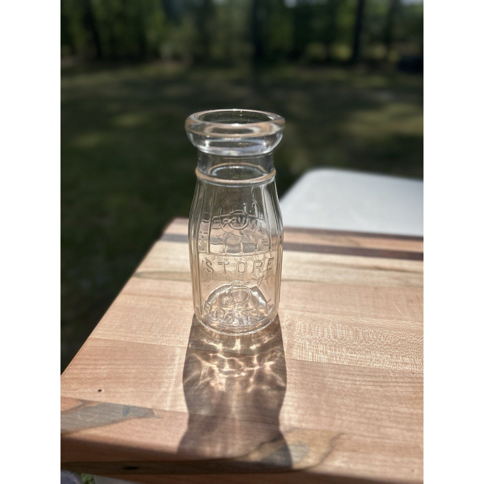 Universal Store glass milk bottle 5 cent deposit back view