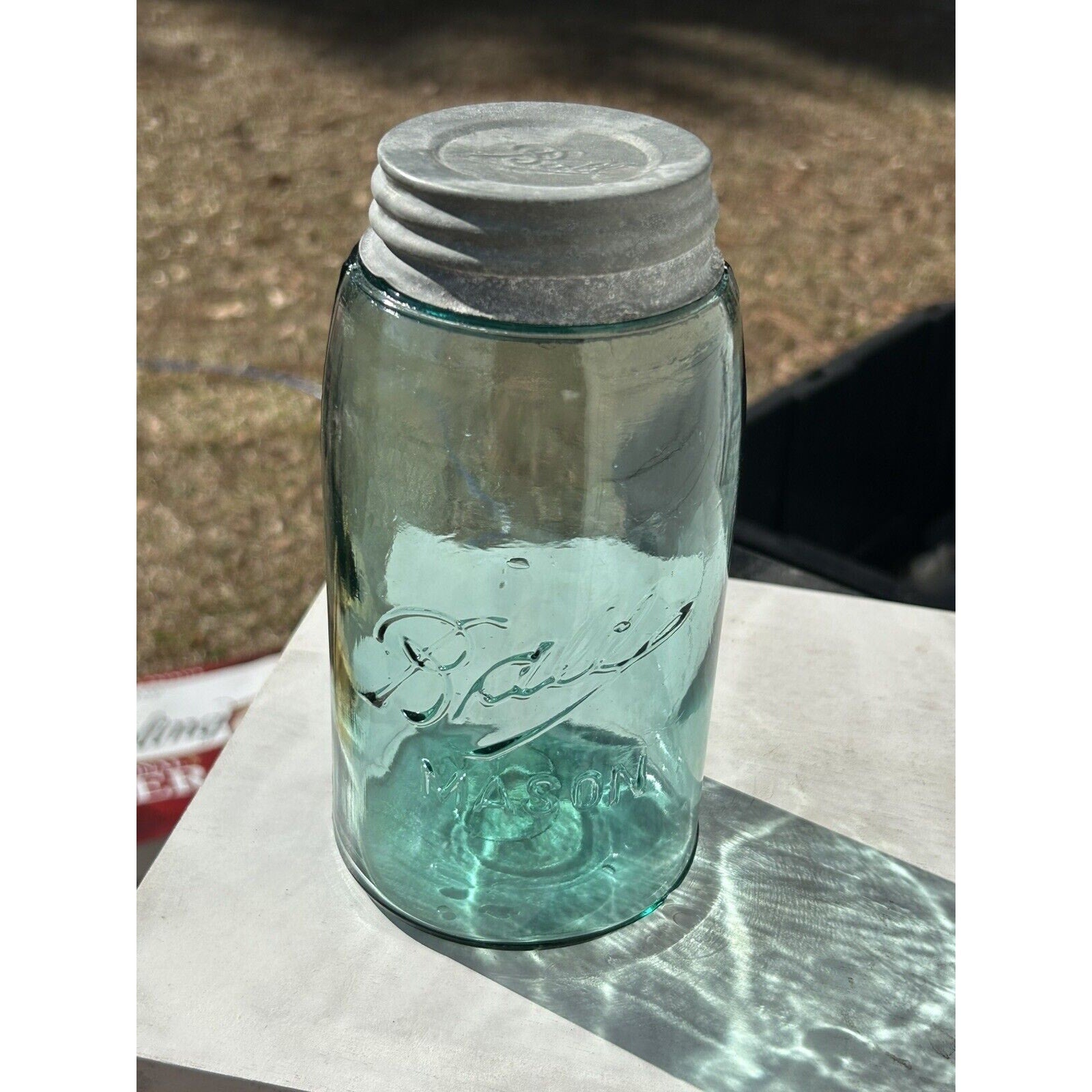 Ball Triple-L quart jar aqua blue — natural light view showing glass clarity and bubble detail