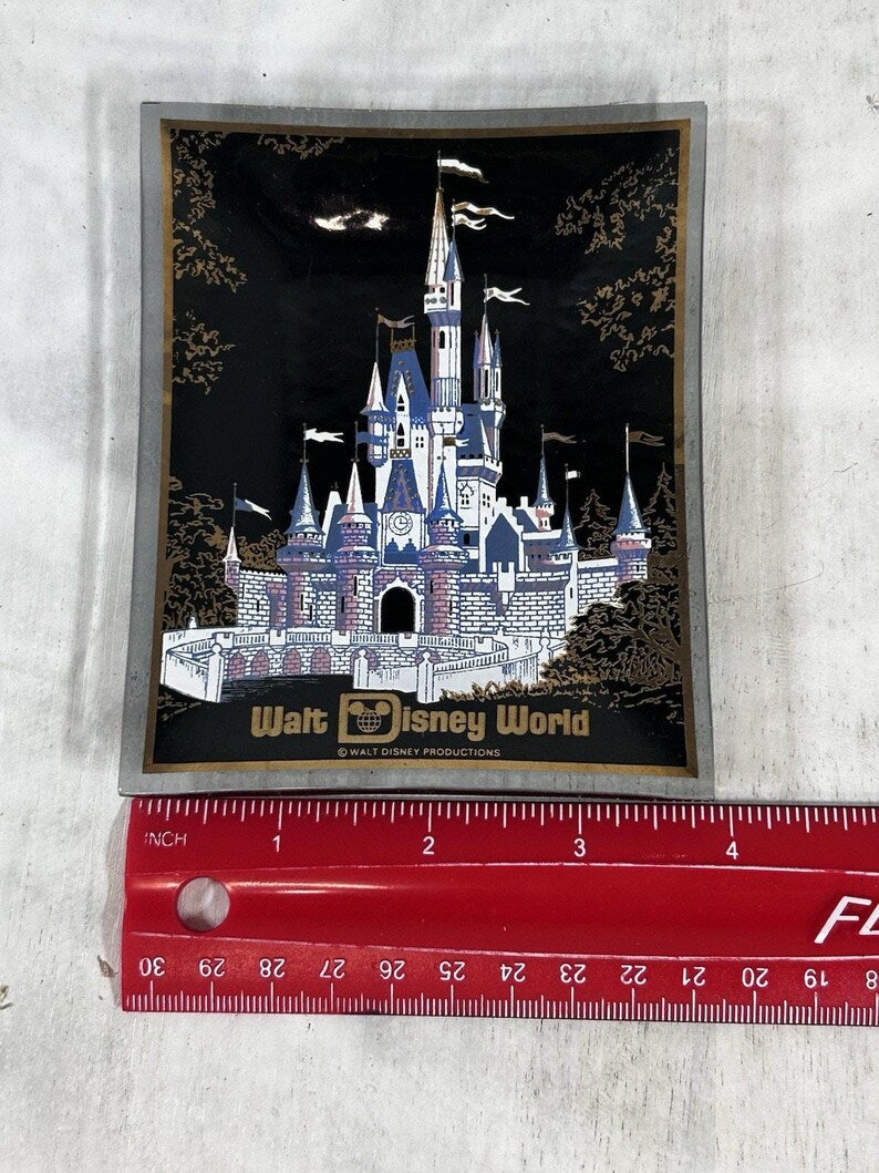 Alternate front close-up of the colorful castle and gold floral corner decoration.