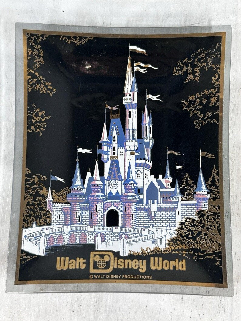 Close-up of the castle artwork, black enamel field, and gold decorative accents.