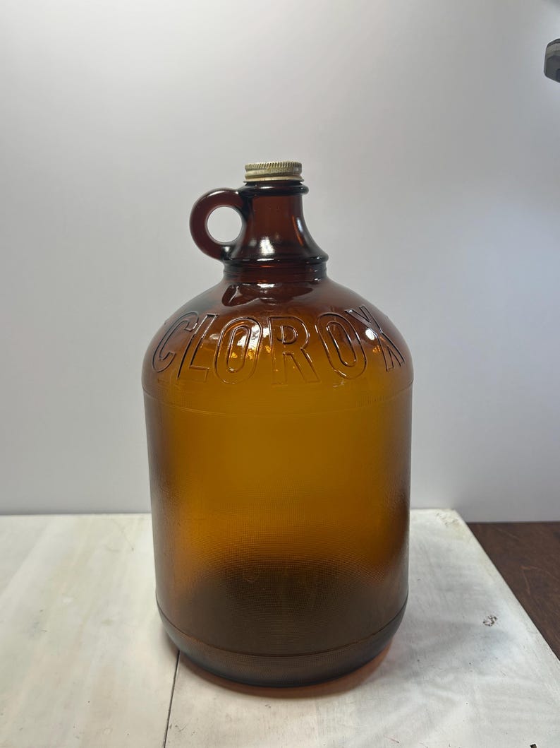 Left angled view of the jug with the loop handle visible near the neck.