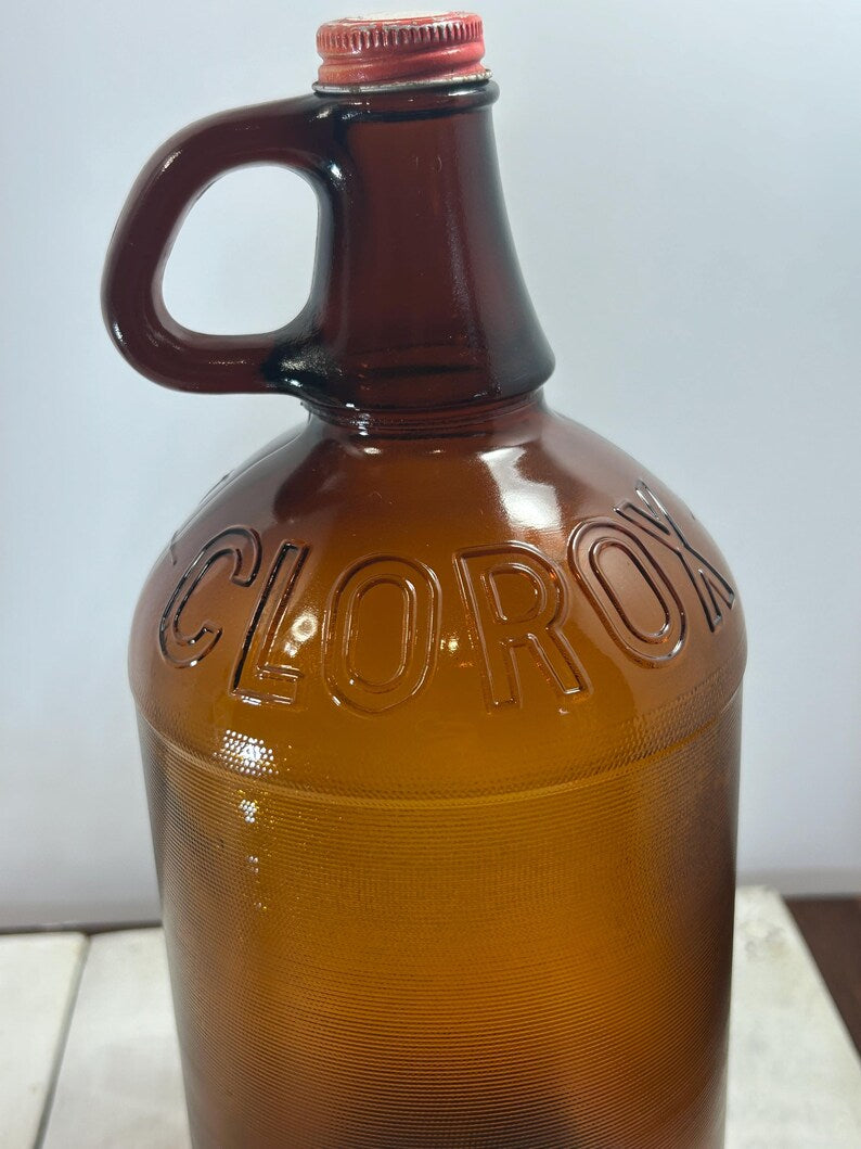 Close-up of embossed Clorox lettering on the large jug shoulder.