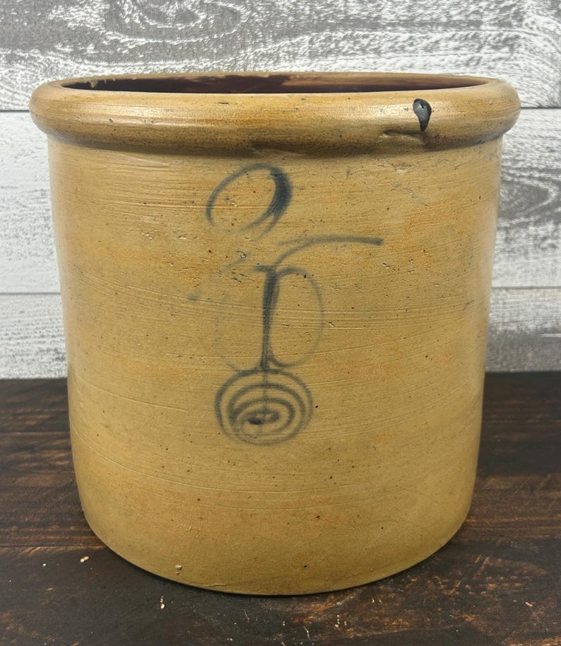 Front view of two-gallon salt-glazed stoneware crock with cobalt lazy-eight and target decoration.