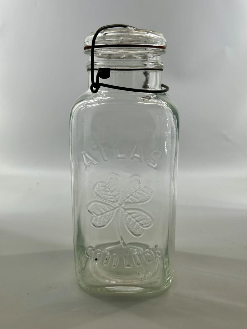 Back view of the clear jar with wire-bail lid against a light background.