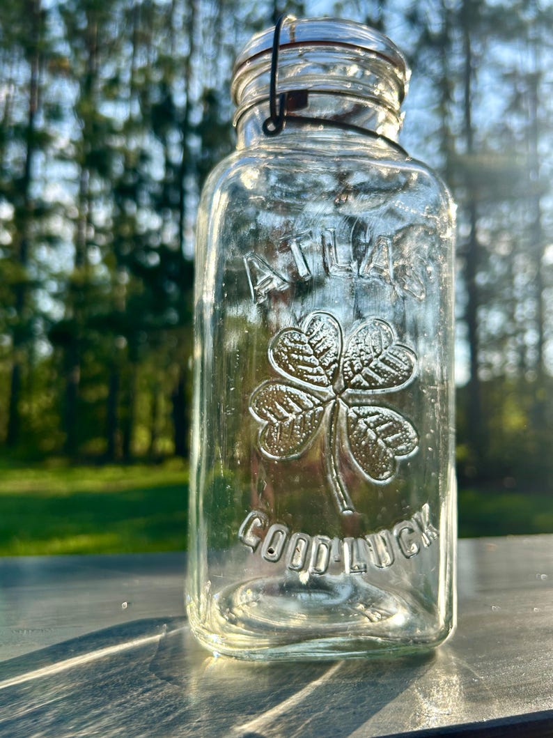 Closer outdoor view of the embossed clover and Good Luck lettering.