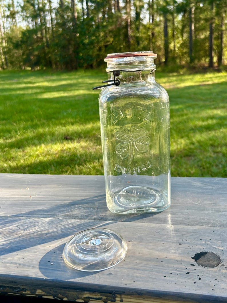 Full jar outdoors with the glass lid removed and placed beside it.