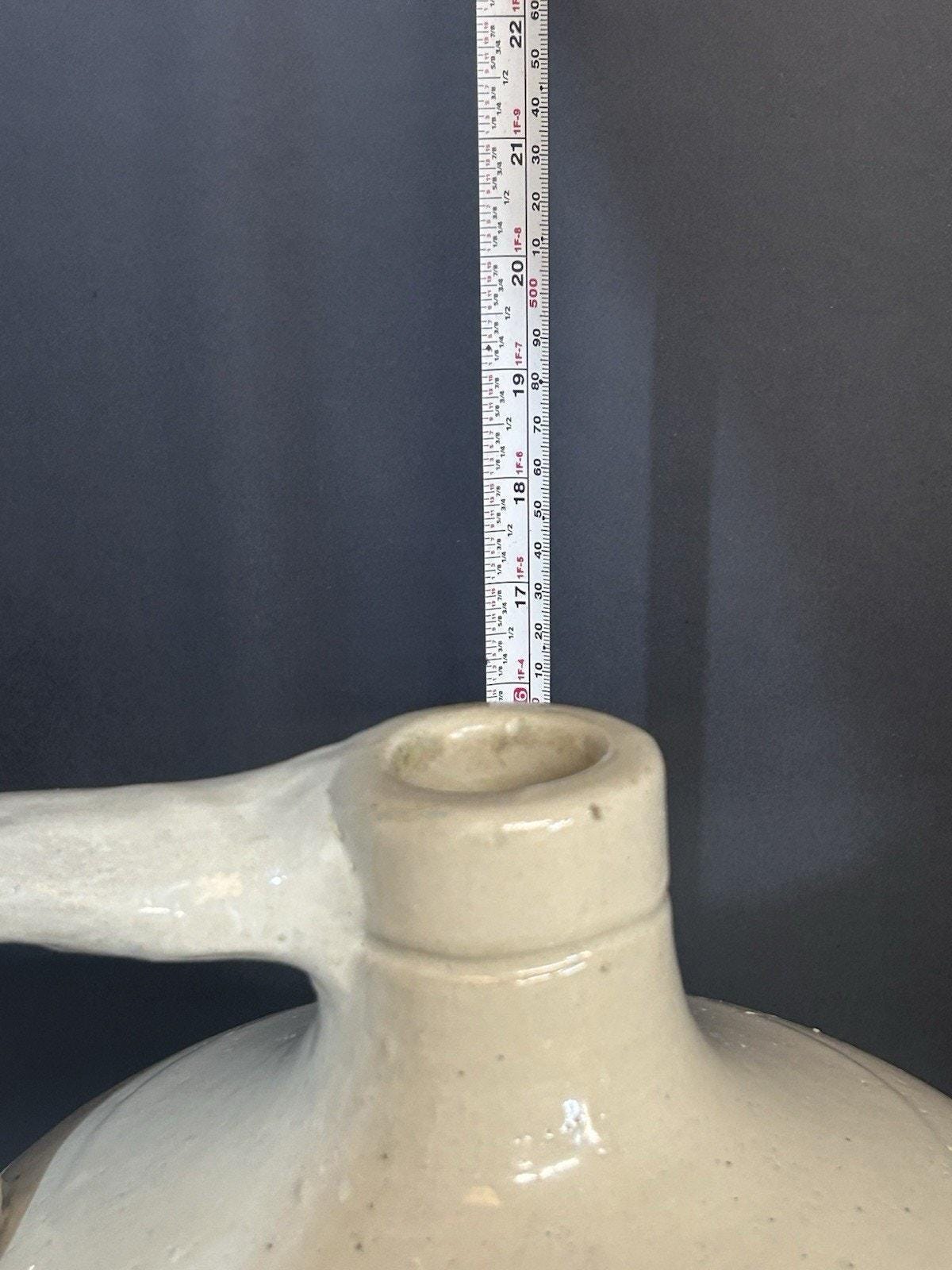 Albany slip brown shoulder glaze on Red Wing jug