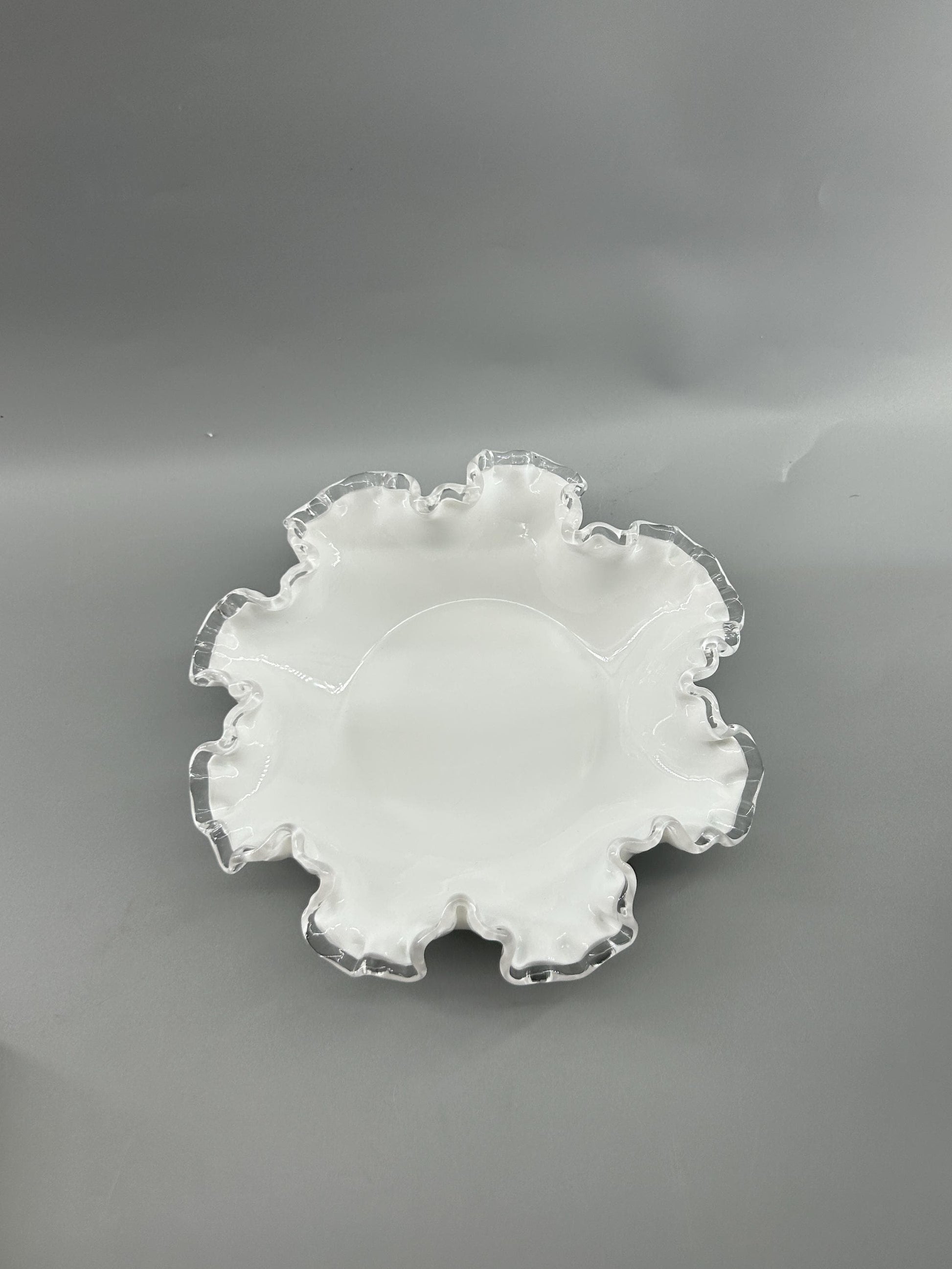 Applied clear crest edge on Fenton milk glass bowl
