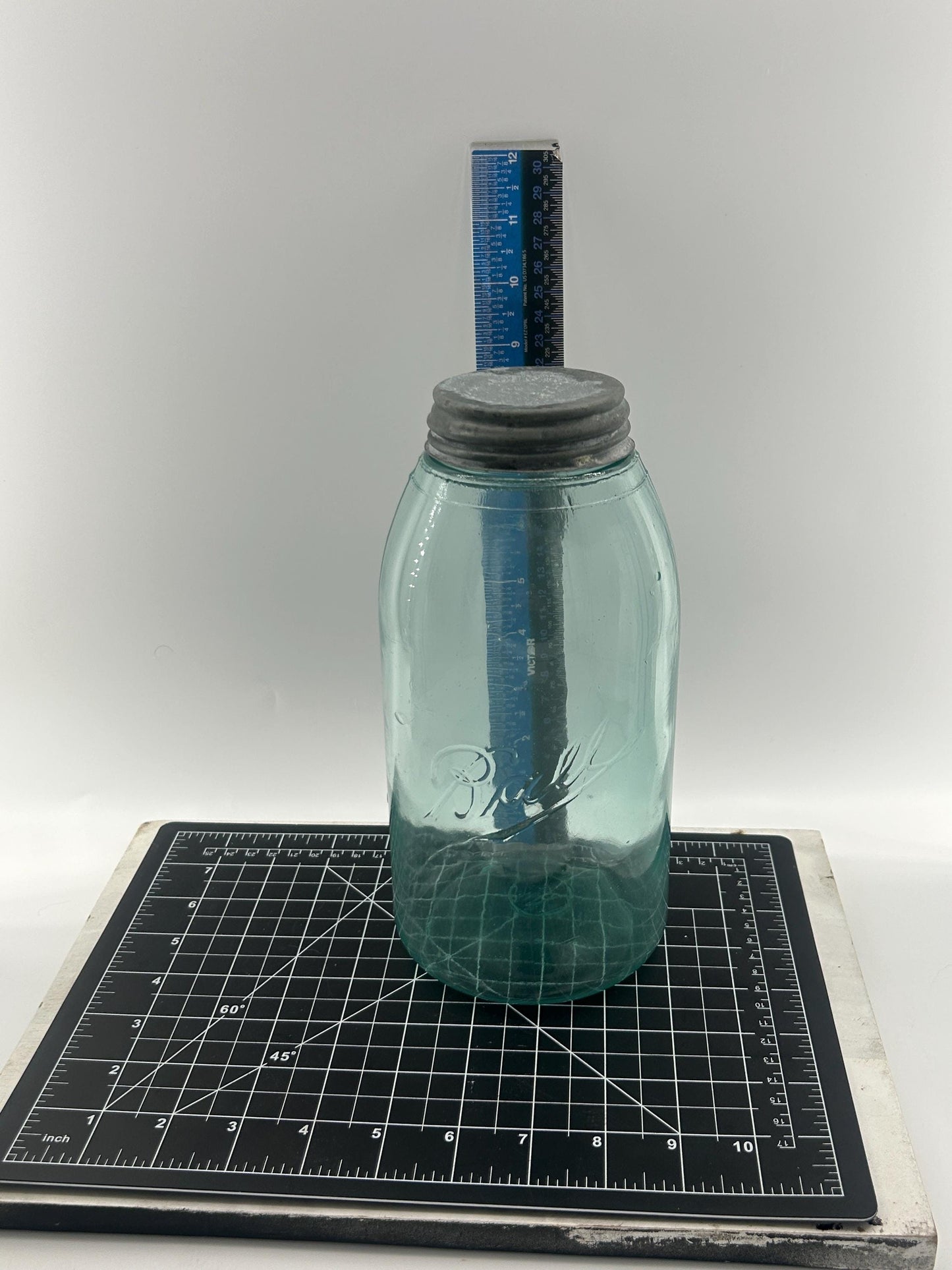 Zinc lid on antique half gallon Ball jar