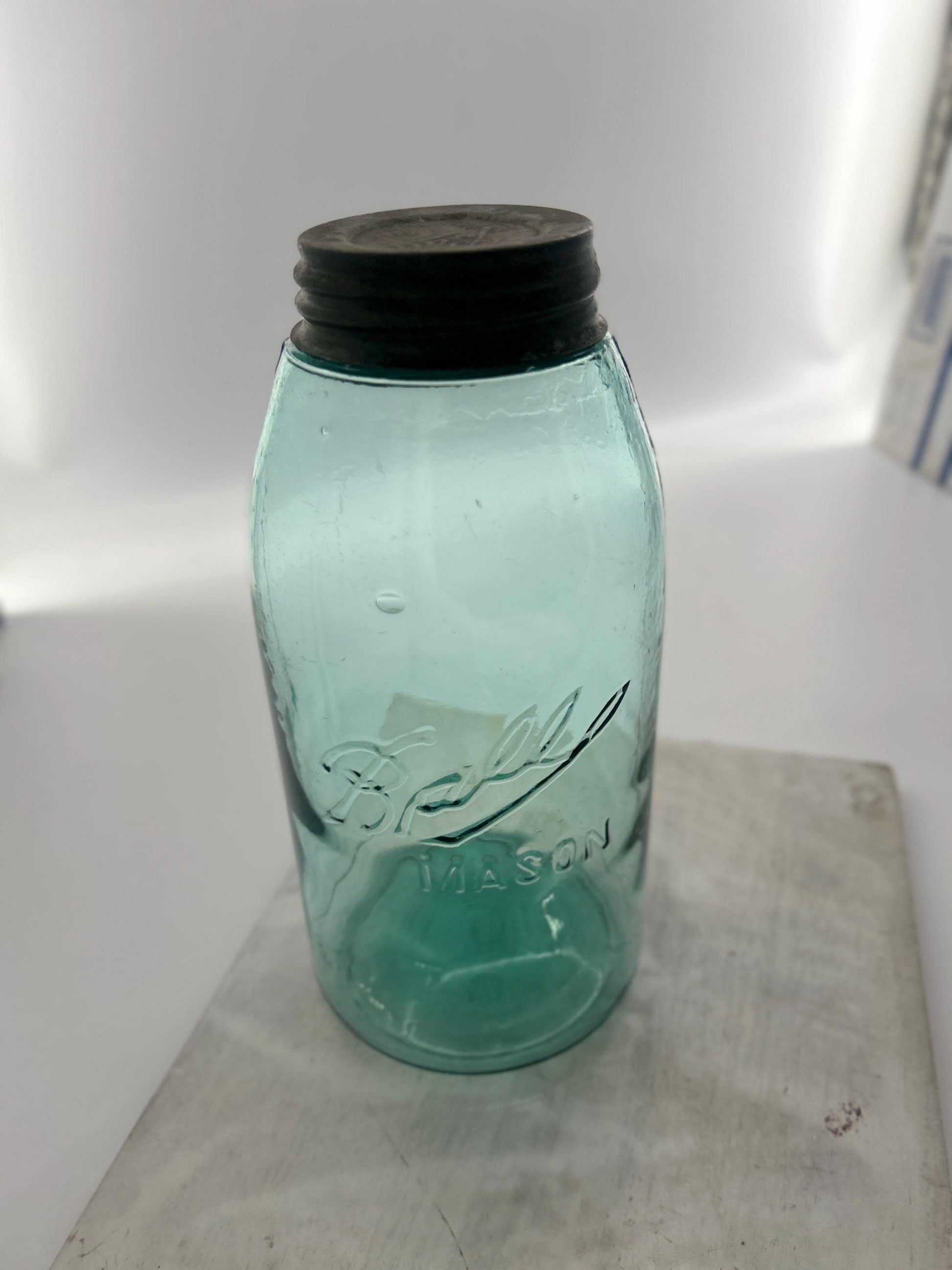 Seed bubbles in antique Ball fruit jar glass