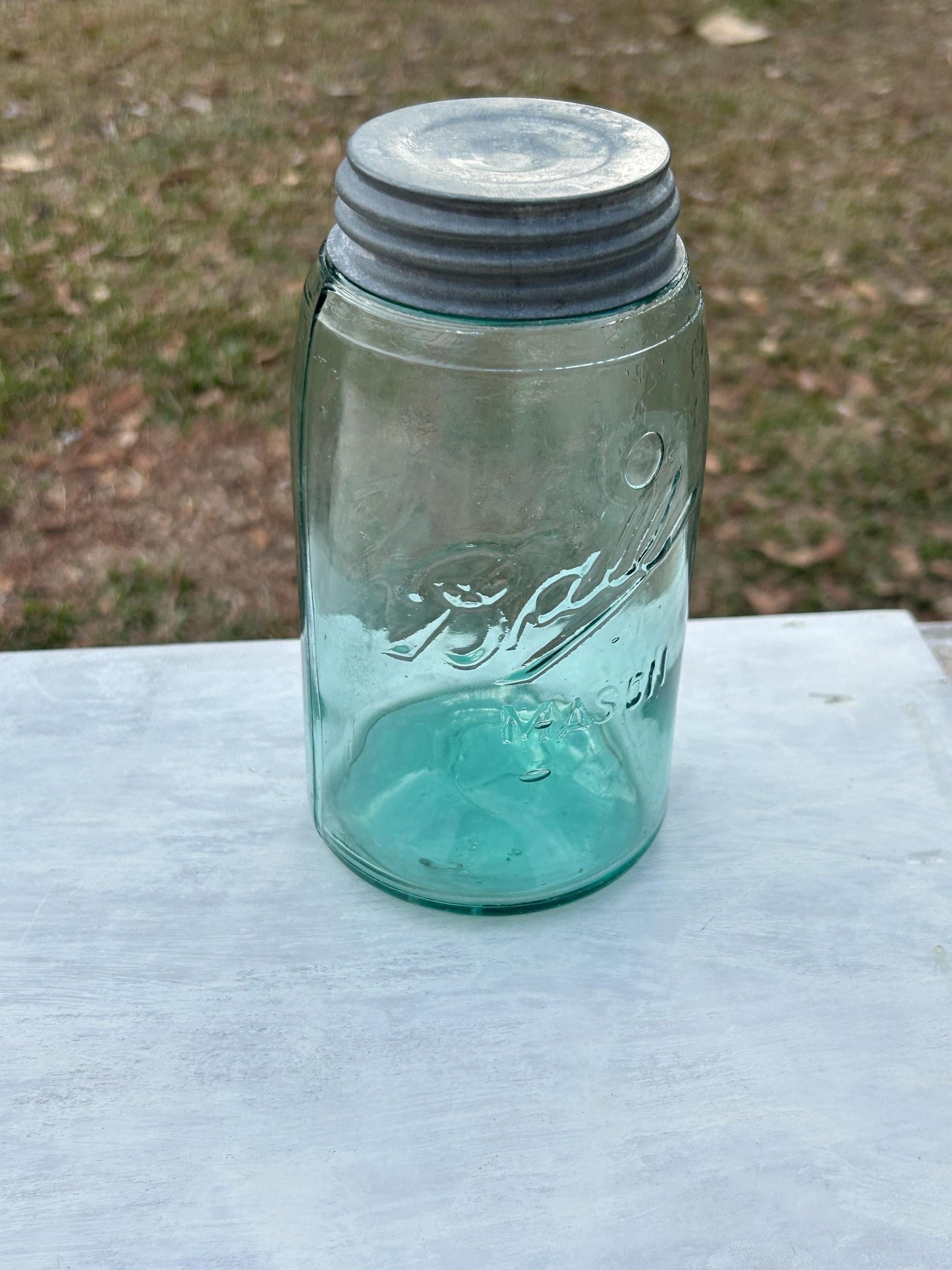 Antique green mason jar base and glass character