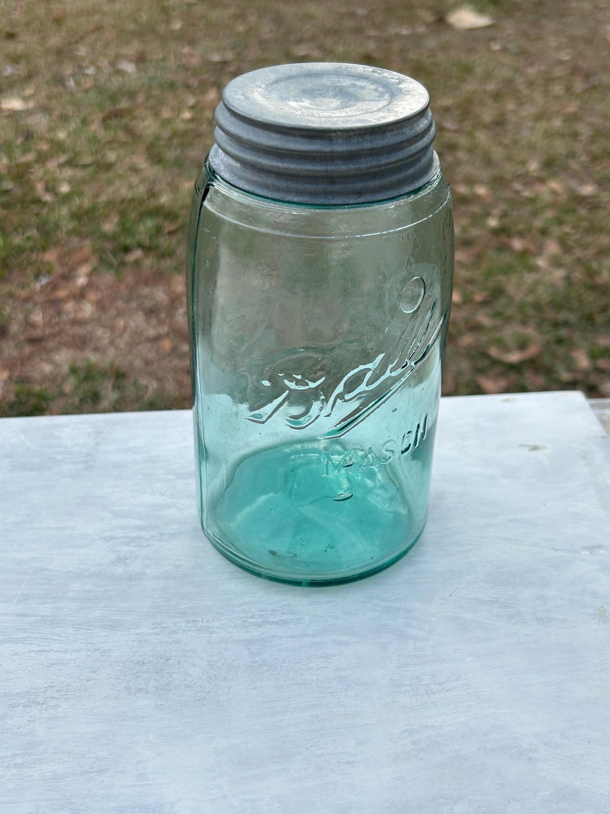 Antique green mason jar base and glass character