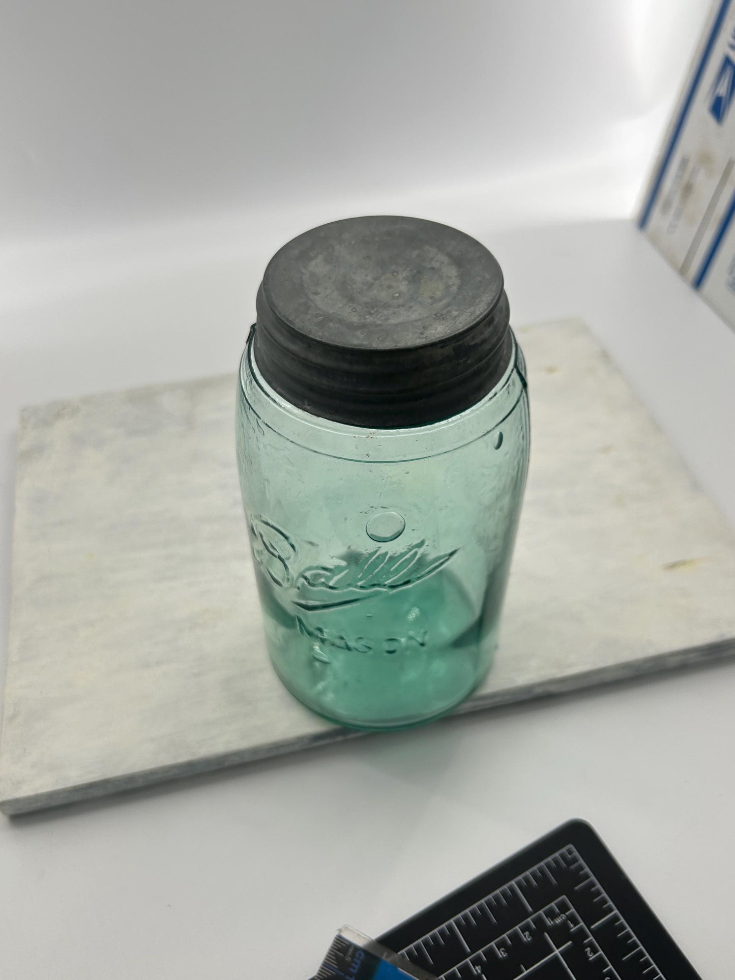 Condition details on antique Ball green glass jar