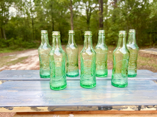 Seven antique The Original 3 Centa Drink aqua embossed soda bottles